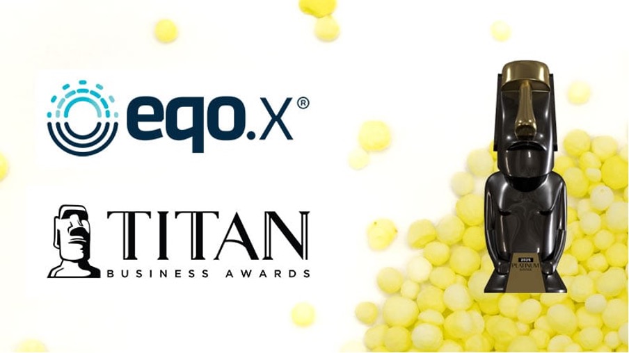 eqo.X receives the 2023 Platinum Winner Titan Business Award, represented by their logos and a Moai statue trophy.