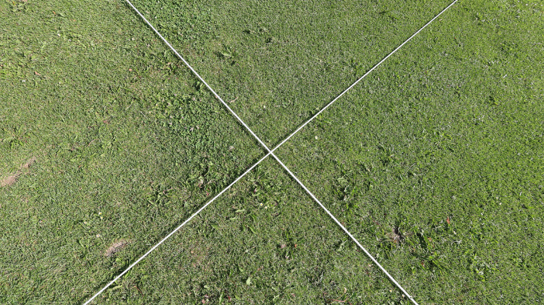 Overhead view of marked fairway trial plots comparing integrated turf management treatments at Golfcentrum de Batouwe.