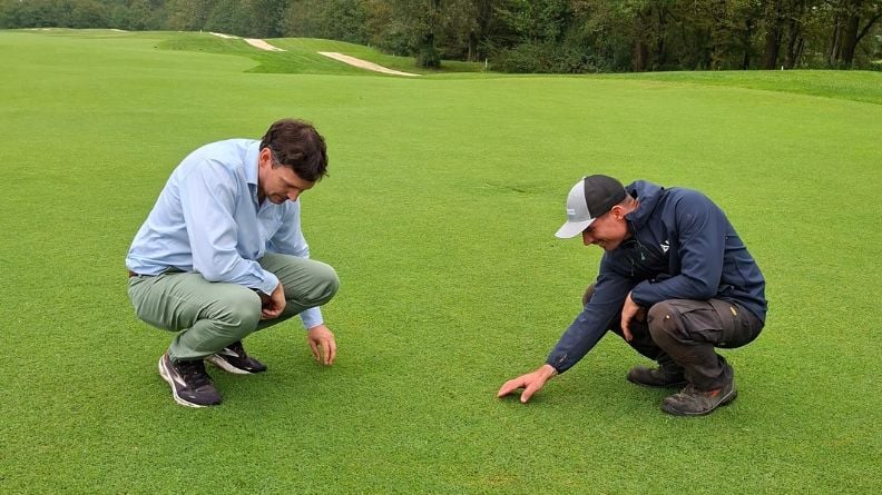 Nicolò Stocco and Giacomo Defanti examining the established ProSelect Rio Bermudagrass on a fairway at Asolo Golf Club, Italy.